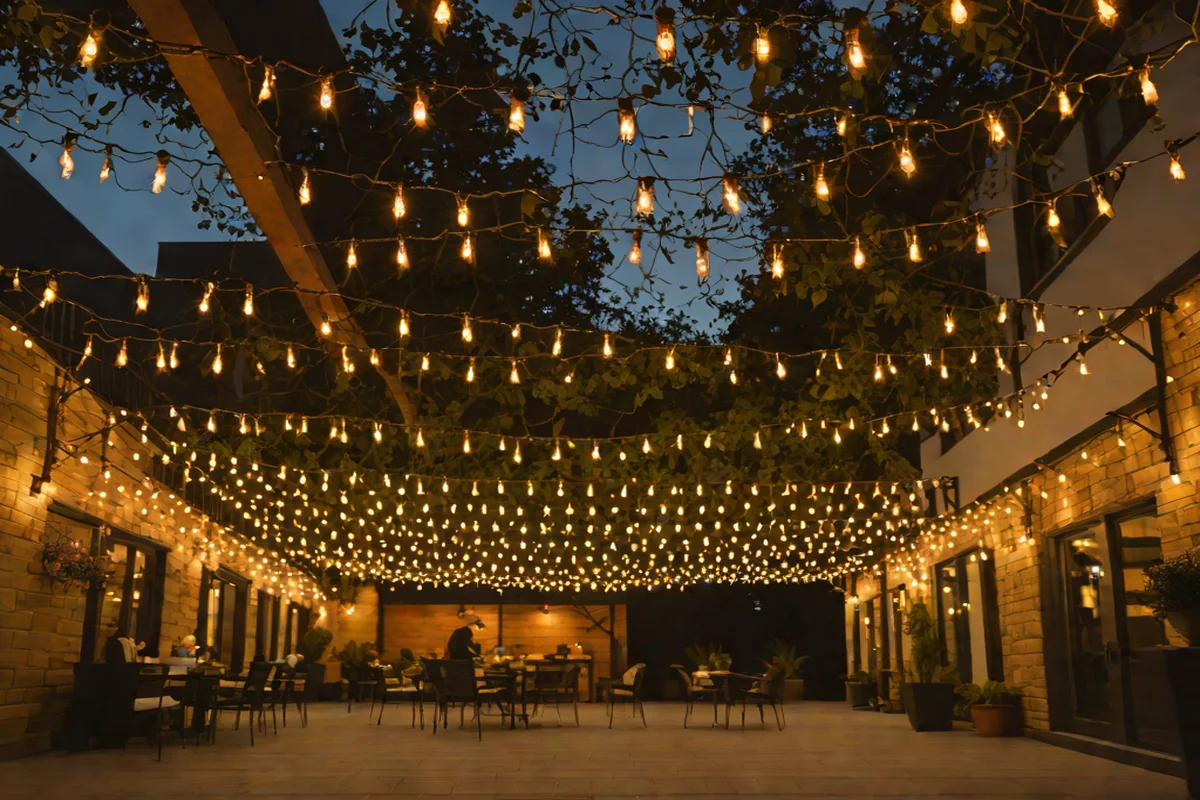 String Light Canopies for Atmospheric Glow: - Concrete Slab Patio Makeover Ideas